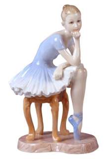 Figurine of Young Ballerina Observe While Resting  