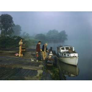 Boat Crew Cooks Breakfast on a Old Wrecked Barge in Morning Fog 