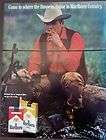 1970 Marlboro Man cowboy relaxing with cigarette vintage ad