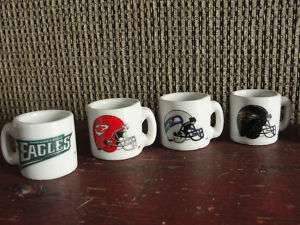 Set of 8 miniature NFL football collector mugs  