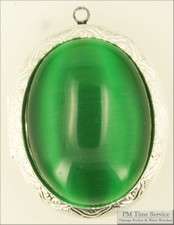 WBM lg. oval engraved locket, green cats eye cabochon  